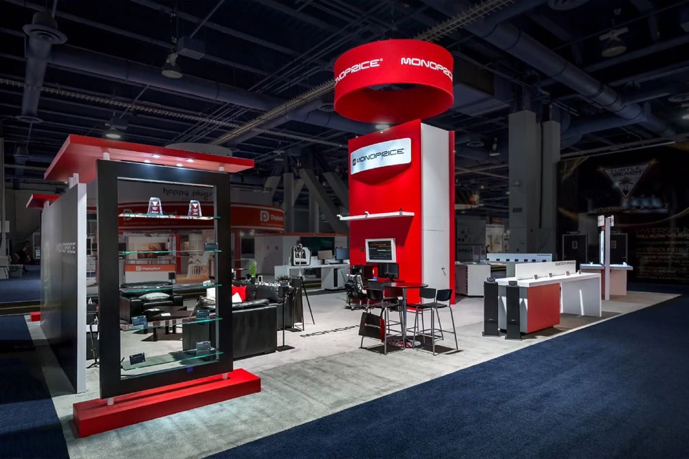 Monoprice booth with a red tower and doorframe
