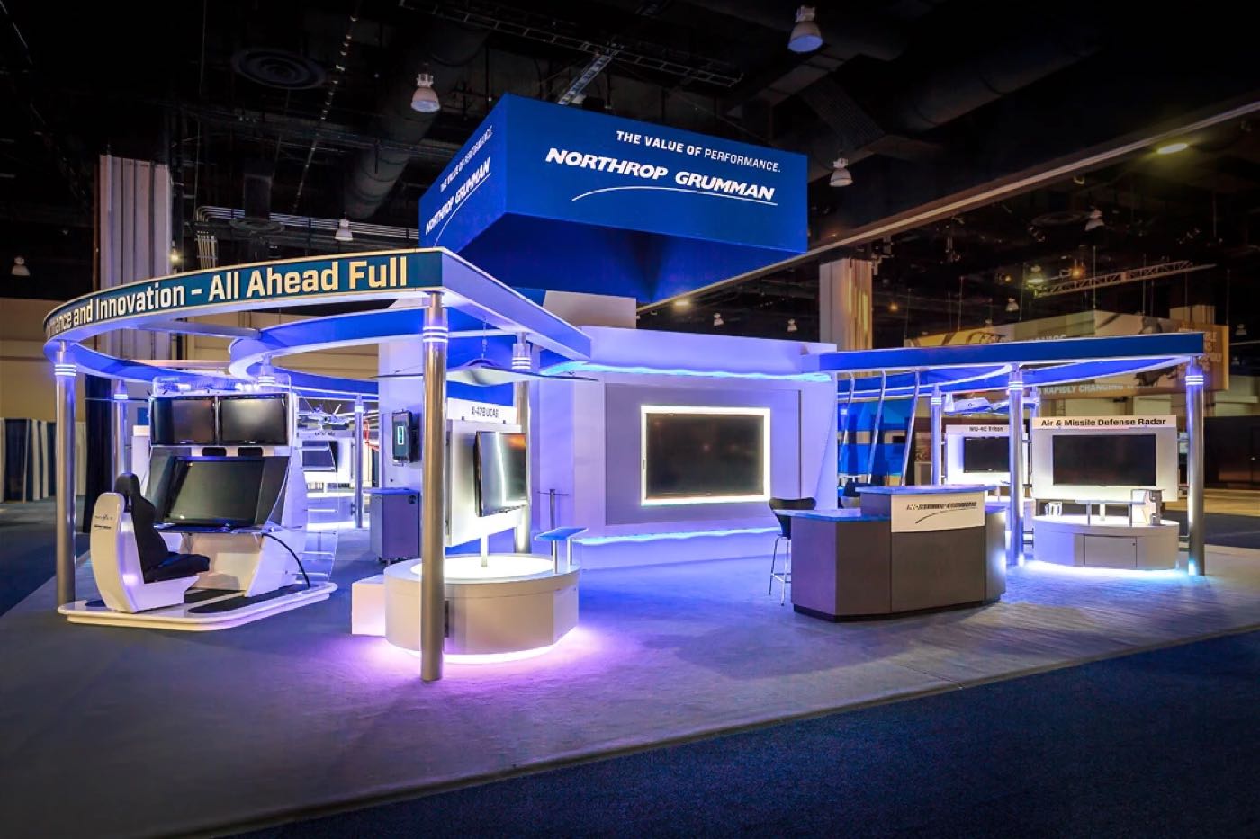 Northrop Grumman island booth lit in blue