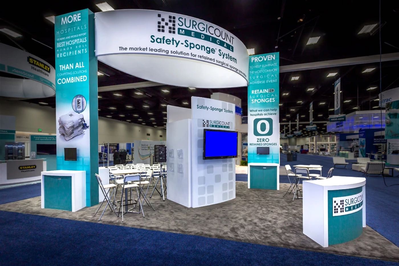 Surgicount Medical booth with a round overhead sign